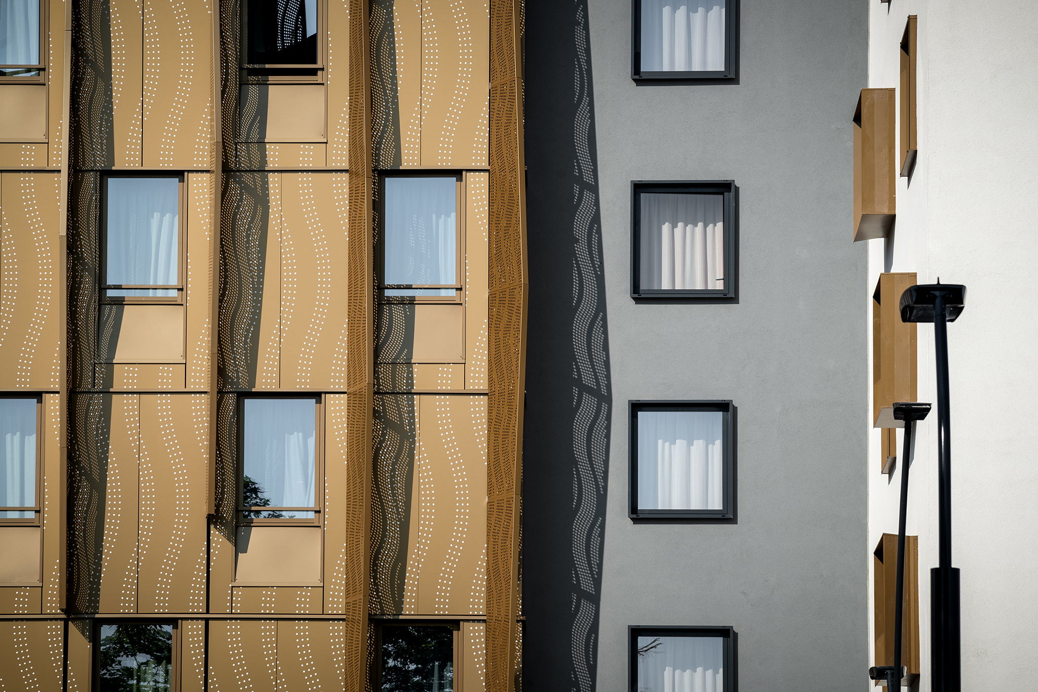 Construction de logements sociaux, de logements en accession et d'un hôtel, îlot Bouillet, à Clermont-Ferrand, détail façade